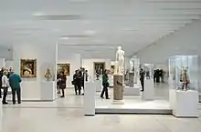 visitors viewing the exhibits in the gallery