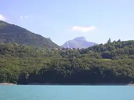 The village seen from the Lac du Sautet [fr]