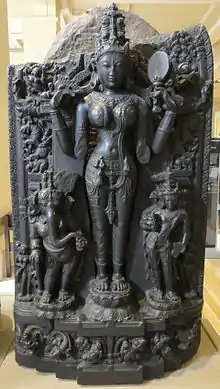 Pala basalt statue of Lalita flanked by Gaṇeśa and Kārttikeya, 11th century