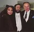 Lara Saint Paul, opera singer Luciano Pavarotti and Lara's husband, producer Pier Quinto Cariaggi. Lara Saint Paul and Cariaggi produced and wrote a documentary on Pavarotti titled The Best is Yet to Come.