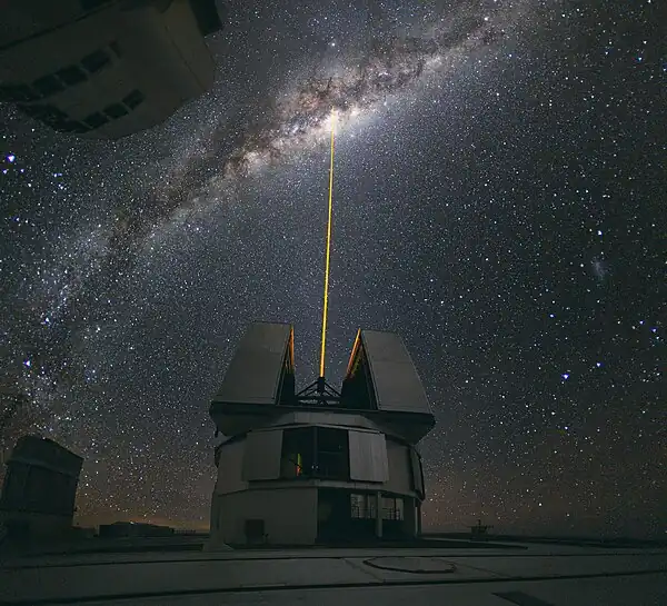 Image 16Adaptive opticsPhoto: Yuri Beletsky, ESOA laser shoots towards the centre of the Milky Way from the Very Large Telescope facility in Chile, to provide a laser guide star, a reference point in the sky for the telescope's adaptive optics (AO) system. AO technology improves the performance of optical systems by reducing the effect of atmospheric distortion. AO was first envisioned by Horace W. Babcock in 1953, but did not come into common usage until advances in computer technology during the 1990s made the technique practical.More selected pictures