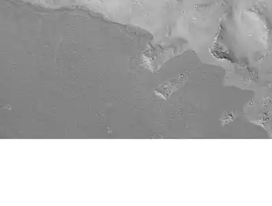 Lava flow in Elysium. There are many lava flows in Elysium. In this one, the lava flowed toward the upper right. Image taken by Mars Global Surveyor, under the MOC Public Targeting Program.