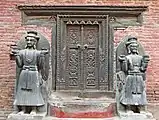 Stone images of Ranajit Mala (right) and his father Bhupatindra Malla (left) as the guardians of the entrance to the Bhairava Chwōkā, Bhaktapur Durbar Square