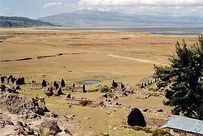 The archaeological site of Inkawasi with the volcano Sara Sara and the lake Parinaqucha in the background