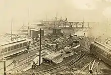 Overhead view of a construction site with streetcar tracks running in several directions