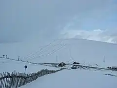 The Lecht Ski centre base lodge, viewed from the Eagle ski runs. The Buzzard poma can be seen in the background.