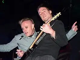 Davies (right) performing with Keith Flint