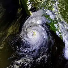 Satellite image of a tropical cyclone in the northeast Pacific Ocean. The hurricane has a ragged eye.