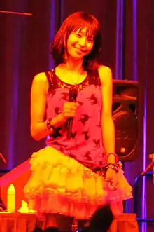 A woman in a red dress on a stage