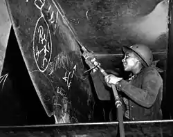 Eastine Cowner, a former waitress, at work on the Liberty ship SS George Washington Carver at the Kaiser shipyards, Richmond, California, in 1943.