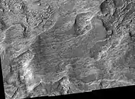 Libya Montes Region, as seen by HiRISE Image contains some sheer rock cliffs.