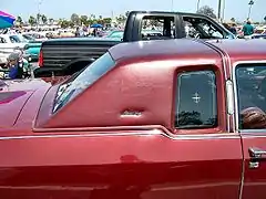 1970s opera window and vinyl "landau" roof imitating horse and buggy design, in particular the Landaulet (carriage)