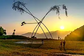 Children playing traditional Dashain Swing in Nepal.