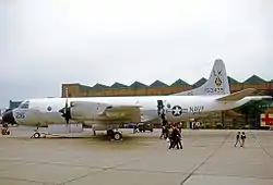 Large plane on the tarmac, with wheels chocked