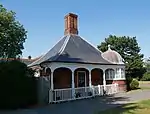 Victorian gate lodge, part of a Grade II–listed structure