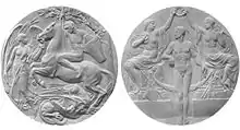 Two grey circular medals are shown side by side. The one on the left depicts a man riding a horse over a dragon, next to an angel; the one on the right shows two partially clothed women holding a laurel wreath over a naked man.