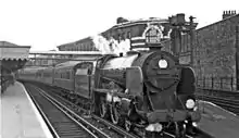 Photograph showing a Schools class locomotive hauling a Hastings-bound passenger train. These locomotives were built in the 1930s to the Hastings line loading gauge.