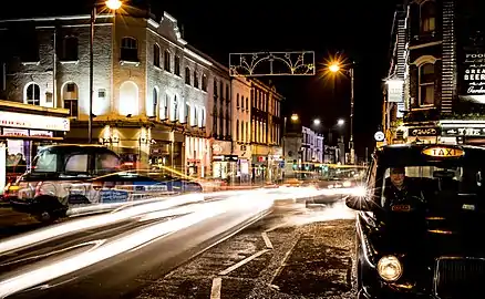 Taxi outside Sutton station at night