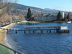 Lords Beach with two covered piers. The pier in the foreground is known as Waimea Jetty, built in the 1960s.