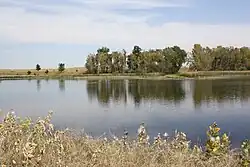 The leaves are beginning to change color around Lower Derby Lake, the largest lake on Rocky Mountain Arsenal National Wildlife Refuge.