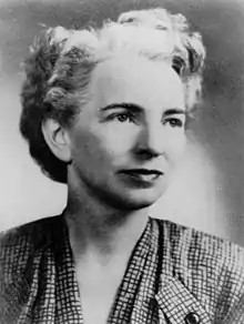 The female head of the Cadet Nurse Corps seated in civilian clothing