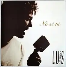 Silhouette of Luis Miguel holding a microphone