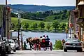 Tourists enjoy a carriage ride through the historic district of Lunenburg. The landscape is dominated by rolling drumlins—a consistent feature of the region.