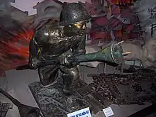 A statue of Nguyen Van Thieng holding his Lunge Anti-Tank Mine. Photo taken from the Vietnam Military History Museum, Hanoi, Vietnam.