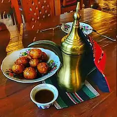 Image 5Luqaimat (lugaimat in Emirati dialect), a traditional Emirati dessert, served with Arabic coffee. (from Emirati cuisine)