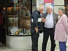 Edward Luttwak holds an issue of Lotta Comunista, Italian Left Communist monthly