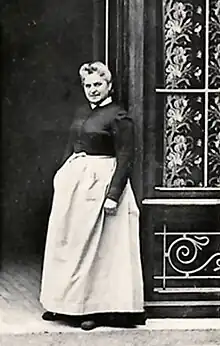 Woman standing in shopfront