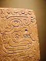 Chavín stela depicting a brindle face. National Museum Chavín de Huántar.