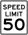 A vertical rectangular white sign with a black border, with the words "SPEED LIMIT" above the number "50"