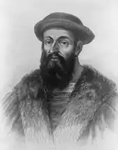  Head and shoulders of a heavily bearded man wearing a cloak and a soft hat