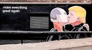 Street art mural ″Make Everything Great Again″ depicting US Republican presidential candidate Donald Trump giving a French kiss to Russian president Vladimir Putin