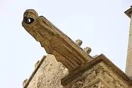 Gargoyle of a character called the Malaucœureux, mouth wide open to let water through