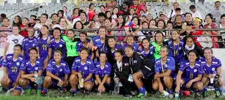 Philippine national team players in blue posing as a team