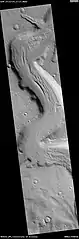 Wide view of Mamers Vallis with cliffs, as seen by HiRISE