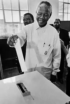 Image 46Nelson Mandela voting in 1994, after thirty years of imprisonment. (from 1990s)