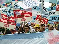 Image 54Union members march in Argentina on Human Rights Day in December 2005.  The signs read "Worker rights are human rights..