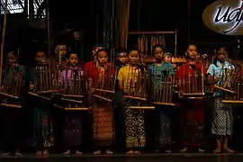 Playing Angklung.