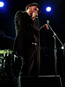 Eitzel singing into a microphone