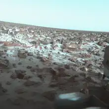 The dry, rocky and icy surface of planet Mars (photographed by Viking Lander 2, May 1979) is composed of iron-oxide rich regolith