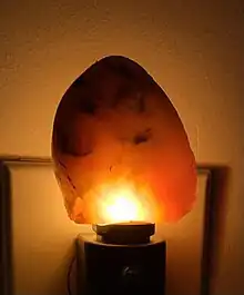 This stone has been cut in half to and illuminated from behind to show the internal structures