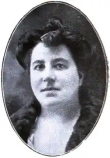 A white woman with dark hair, in an oval frame. She may be wearing a fur collar or stole.