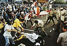 Image 50University students and police forces clash in May 1998 (from History of Indonesia)