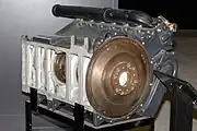 Maybach HL210 P45. The entire engine block is a single aluminium alloy casting from the top of the cylinders to the bottom of the crankcase. Photo shows underside of crankcase, with part of tunnel crankshaft. The crank webs are circular, supported by outsize bearings which locate into machined housings. Note centre bearing with groove (partially shown) for semi-circular retaining rings. The flat bottom cover (removed) would be bolted to the underside of the crankcase.