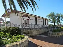 Brick building painted white