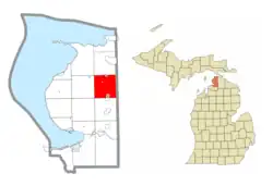 Location within Emmet County (red) and an administered portion of the village of Pellston (1) and community of Levering (2)