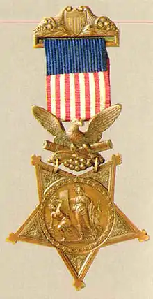 star shaped medal with ribbon that looks like the American flag